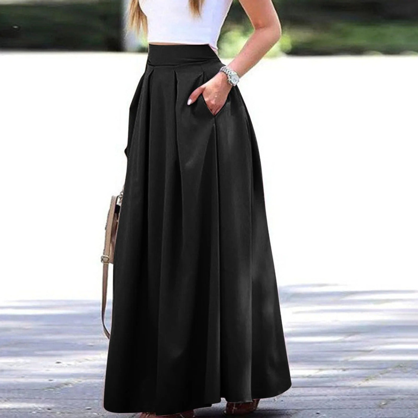 Eleganter und fließender Faltenrock mit hoher Taille, ideal für einen raffinierten und femininen Look